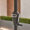 Heavy-duty umbrella stand base with adjustable tilting mechanism for outdoor patio umbrellas, featuring premium build quality for stability and durability.