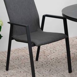 Sleek outdoor dining chair with dark grey upholstered seat and backrest, black metal frame, perfect for a modern patio or garden setup.