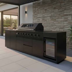 Modern outdoor kitchen with sleek black cabinetry, grill, and built-in mini fridge, perfect for backyard entertaining and outdoor cooking.