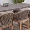 Stylish outdoor dining table with woven rattan armchairs, perfect for garden or patio decor, showcasing durable furniture and comfortable seating options for outdoor entertaining.