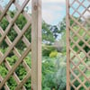Lattice garden trellises for outdoor landscaping and plant support, made of natural wood, enhancing garden aesthetics and functionality. Perfect for supporting climbing plants and creating a charming garden space.