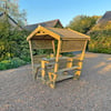 Handcrafted wooden garden gazebo with seating, perfect for outdoor relaxation and entertaining, showcasing quality outdoor furniture from Empire Home and Garden.