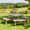 Natural wood outdoor picnic table in a lush garden setting with vibrant flowers and greenery, perfect for outdoor dining and relaxation.