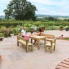 Elegant outdoor patio with natural stone paving, wooden dining furniture, and lush garden backdrop, perfect for outdoor entertaining and relaxing at Empire Home and Garden.