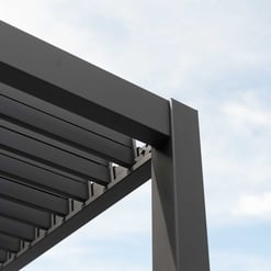 Sleek gray modern outdoor pergola structure with slatted roof, perfect for garden shade and outdoor living spaces, showcasing durable metal construction.