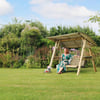 Relaxing outdoor garden swing with a woman enjoying the summer, surrounded by lush greenery and blooming flowers, perfect for outdoor home and garden relaxation and decor.