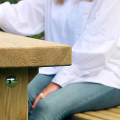 Natural wood outdoor furniture on a deck for garden relaxation and entertaining, showcasing durable, weather-resistant craftsmanship.