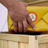 Delivery package being placed into a wooden crate, emphasizing fast and reliable home and garden product delivery.