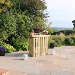 Garden outdoor patio with backyard bar setup, lush greenery, colorful flowers, and scenic view. Perfect for outdoor entertaining, relaxation, and enjoying nature.