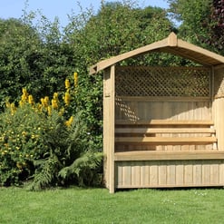 Natural wooden garden bench with a slanted roof in a lush garden setting.