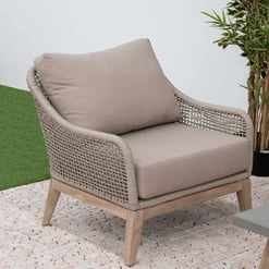 Elegant outdoor wicker loveseat with plush cushions, ideal for garden lounging and patio decor, featuring durable weather-resistant materials for stylish backyard furniture.