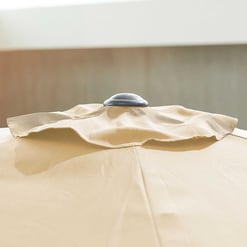 Blank beige patio umbrella with a silver vent on top, designed for outdoor garden and patio comfort at Empire Home and Garden.