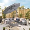Modern outdoor patio furniture with sectional sofa, coffee table, and umbrella in a stylish backyard setting. Perfect for outdoor entertaining and garden design.