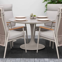 Sleek outdoor patio dining set with six comfortable cushioned chairs and a round table, perfect for garden entertaining and enhancing home outdoor spaces.