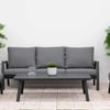 Stylish outdoor patio furniture set with gray cushions, surrounded by lush green plants and hydrangeas, ideal for garden or backyard relaxation and entertaining.