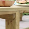 Natural wood outdoor table with sturdy construction, ideal for garden and patio dining, showcasing craftsmanship and durable materials.