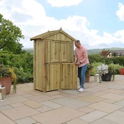 Sturdy wooden outdoor shed being assembled in a scenic garden, perfect for backyard storage and organization, showcasing quality craftsmanship and garden storage solutions.