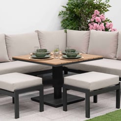 Stylish outdoor patio furniture set with cushioned sectional sofa, matching ottomans, and a wooden dining table, ideal for garden dining and entertaining.