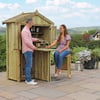 A compact wooden outdoor bar and garden shed with two people enjoying wine in a lush garden setting. Perfect for backyard entertaining, outdoor living, and garden storage solutions.