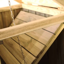 Craftsman outdoor wooden swing with chains, perfect for backyard relaxation and garden decor. Durable cedar wood, handcrafted for outdoor use, combining comfort and natural aesthetics.