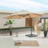 Stylish outdoor patio with large beige umbrella, potted plants, cozy rug, and decorative lanterns, ideal for relaxation and entertaining in your home and garden.