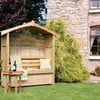 Relaxing outdoor wooden garden shelter with cushions, wine, and books in a beautiful backyard. Perfect for outdoor living, relaxation, and entertaining.