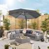 Stylish outdoor patio furniture with a large umbrella, surrounded by potted plants and decorative lighting, perfect for garden entertaining and outdoor living spaces.