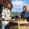 Enjoying outdoor entertaining with a backyard barbecue featuring gourmet sliders, fresh herbs, and scenic mountain views for a perfect garden gathering at Empire Home and Garden.