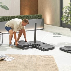 Heavy-duty outdoor basketball hoop system with adjustable height, designed for residential use, featuring sturdy base weights sold separately for stability.