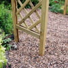 A wooden garden trellis installed on a gravel pathway surrounded by lush green plants and flowers, ideal for supporting climbing plants and enhancing backyard landscaping.