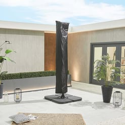 Black patio umbrella cover on a modern outdoor patio.