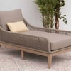 Comfortable outdoor chaise lounge with woven rattan design and plush cushions, perfect for garden patios or backyard relaxation.