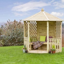 Raised wooden garden gazebo with lattice sides and cozy seating, perfect for outdoor relaxation and enjoying nature. Ideal for garden and backyard home décor.