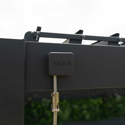 Industrial smart lock on modern black outdoor furniture for enhanced security and style.