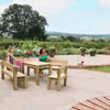 Relaxed outdoor patio with garden furniture and blooming flowers, ideal for outdoor dining and entertaining in your home and garden.