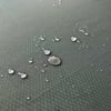 Water droplets on outdoor fabric emphasizing water-resistant garden furniture, ideal for backyard patios, outdoor dining, and garden lounging. Perfect for outdoor living spaces.
