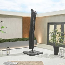 Modern outdoor patio with a black umbrella, potted plants, decorative lanterns, and minimalist design elements, perfect for outdoor living spaces and garden furniture.