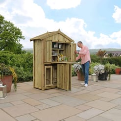 Custom outdoor wooden bar with beverage storage and countertop on patio in garden setting, perfect for entertaining. Stylish backyard bar ideal for outdoor gatherings and garden decor.