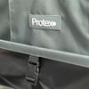 Protex branded outdoor gear with durable fabric and secure buckle closure, ideal for gardening, outdoor activities, and home garden storage solutions.