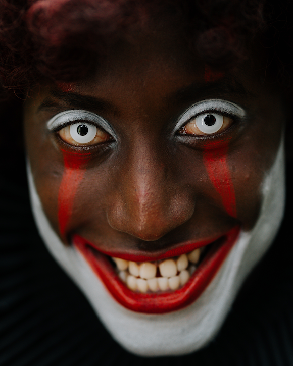 Karif Battle, founder of Theoretical Fiends LLC, got this photo, by Cottonbro Studio, from Pexels. A supernatural man with white eyes and clown cosmetics smiles into the camera.