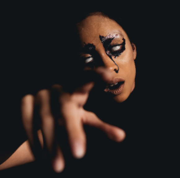 Karif Battle, founder of Theoretical Fiends LLC, got this photo, by Cxpturing Souls, from Pexels. In the dark, a milky-eyed succubus reaches for you.