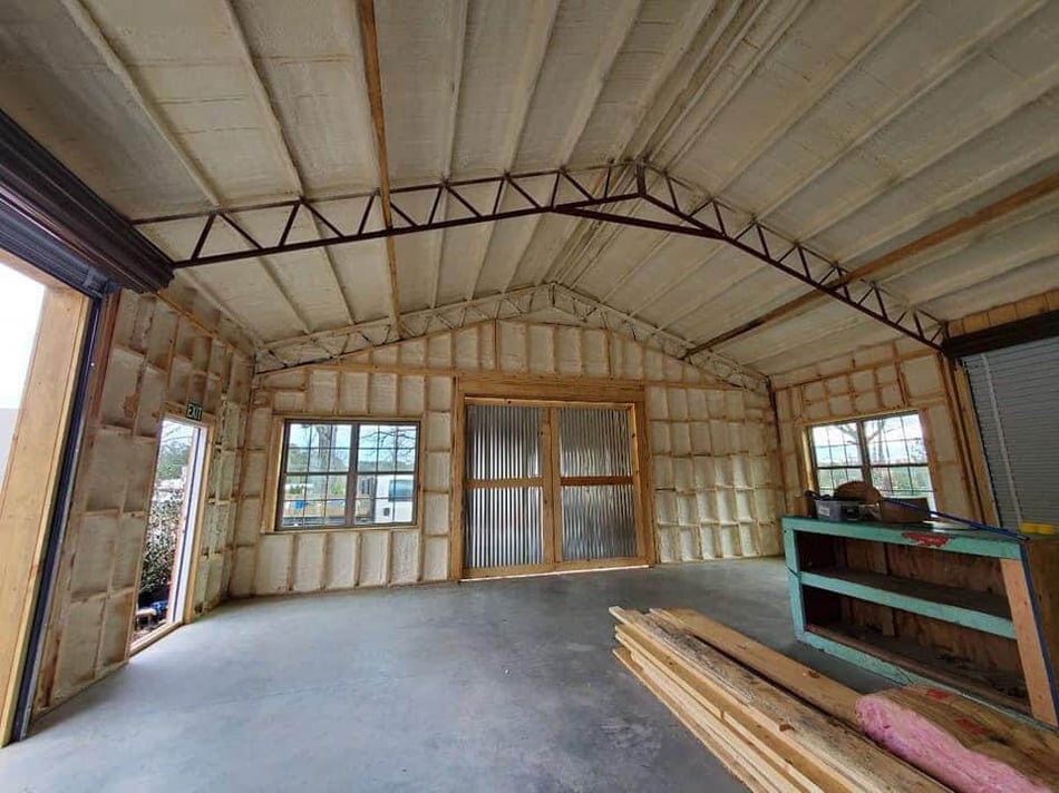 Professional spray foam insulation application during a new construction project to improve energy efficiency and air sealing.