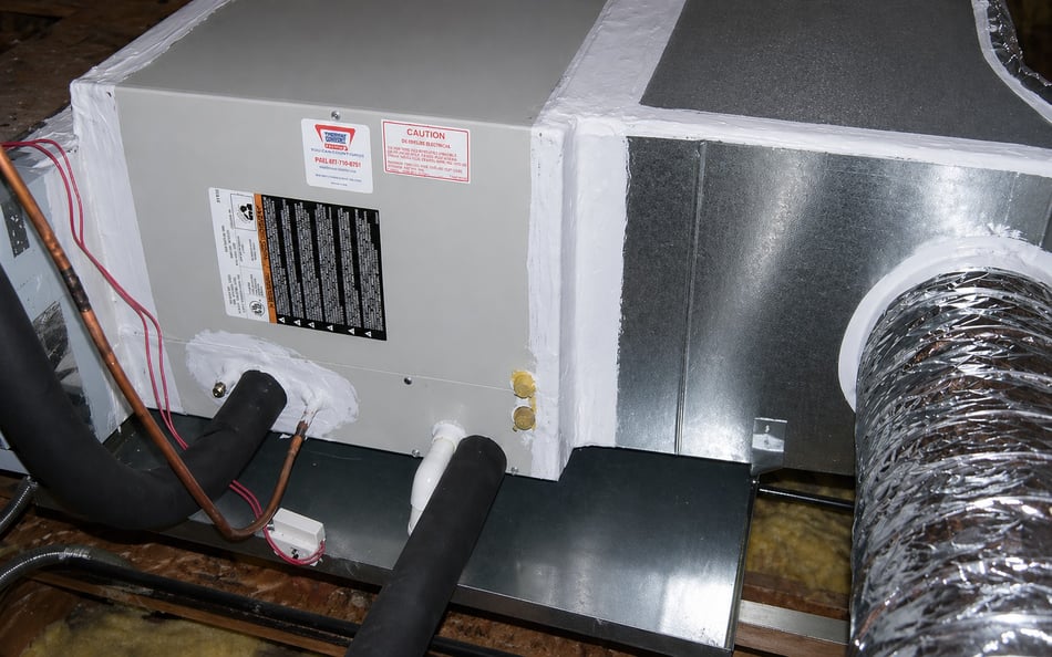 Professional air handler sealing in an attic to prevent air leaks and improve HVAC efficiency for better home insulation and energy savings.