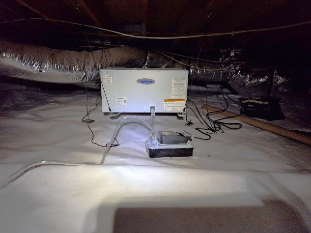 AprilAire dehumidifier installed in an encapsulated crawl space to actively control humidity and moisture levels.