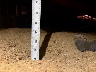 Measuring depth of insulation on attic floor