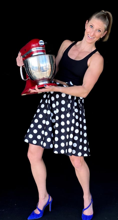 Kindal holding her Kitchenaid mixer ready to cook up some meals