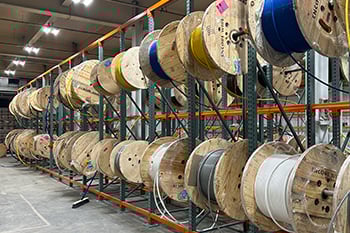 warehouse full of wire hanging on a rack