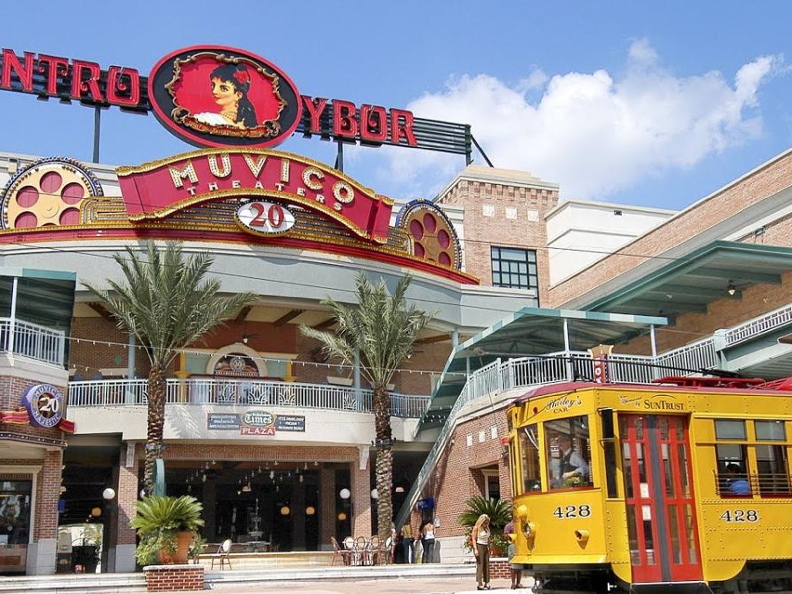 Centro Ybor shopping and entertainment complex with the historic Muvico theater and yellow streetcar in Ybor City, Tampa