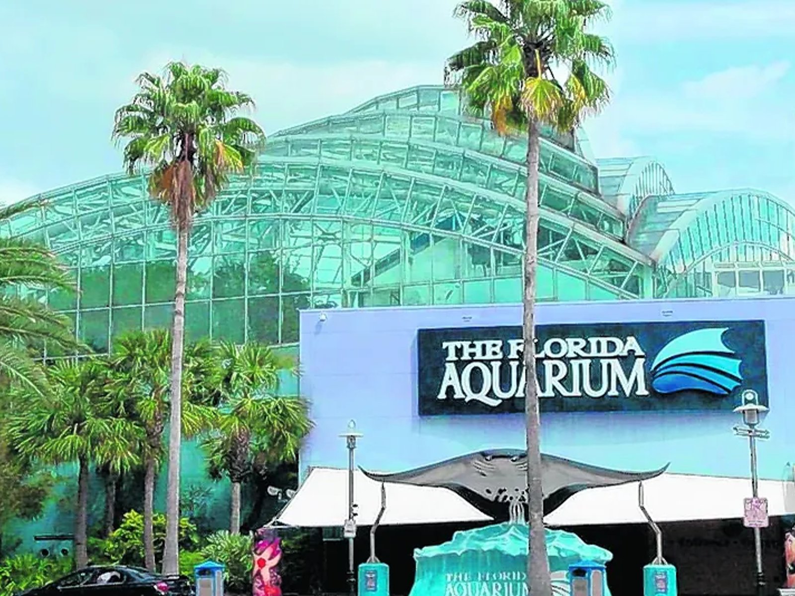 Exterior of The Florida Aquarium in downtown Tampa with its glass-domed roof and entrance sign