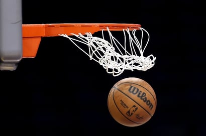 basketball passes through the net